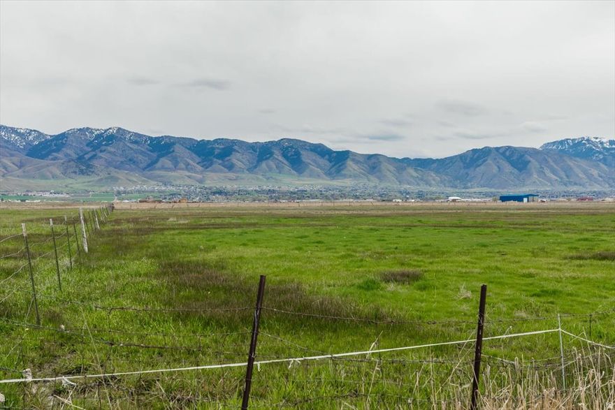 This is the land of many uses, 17 irrigated acres and 8 sub irrigated acres fenced pasture and hay ground. There is a 45 X 100 green house with living quarters started inside. Powered by a 50 kilowatt propane generator and two 1000 propane tank to supply it. There is an artesian well suppling the irrigation and culinary water. Also included is a 1998 Argo Allis 8765 4wd Tractor with a bucket and pallet forks. Click on Virtual Tour for an interactive Map of the property