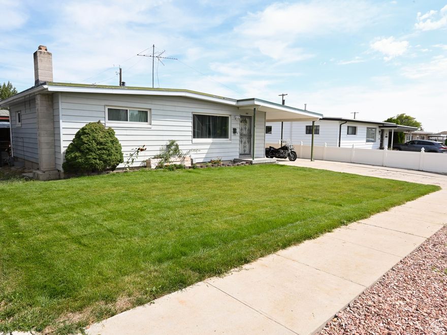Charming rambler with lots of updates and central air! The main level offers a welcoming flow, while the downstairs is already set up for extra living, a game room, or future possibilities. A versatile custom entertainment area makes hosting easy but can be styled to your needs. Outside features an inviting backyard, RV parking, garage/workshop, and a dedicated walk-in storage space. This home blends comfort, flexibility, and modern updates all in one! Square footage figures are provided as a courtesy estimate only and were obtained from county records.  Buyer is advised to obtain an independent measurement.