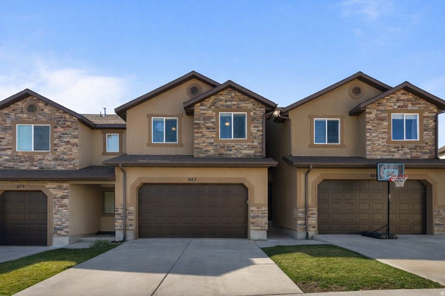 This spacious townhome in Harvest Hills is in a really convenient spot-close to Mountain View Corridor and only about 15 minutes to I-15, so getting around is easy. The neighborhood has a clubhouse with a gym, and you're within walking distance to Harvest Park and Harvest Elementary, which is hard to beat. Inside, the layout feels open and functional, and the kitchen has a cute peninsula that works great for extra seating or just hanging out while cooking. The unfinished basement gives you room to grow or customize down the road (and even includes flooring trim ready for install if you want to finish it out). One thing that really stands out is the small backyard-most townhomes don't offer that, so it's nice to have your own little outdoor space. A big bonus here is the amount of behind-the-scenes work that's already been done. The owners have put over $45K into major updates, including a new A/C compressor, furnace motor, new kitchen appliances and disposal, updated faucets, garage door opener system, and added cupboard hardware. They also installed UV and privacy windows, had the ducts professionally cleaned with UV treatment, and completed a full plumbing line clearing to significantly improve flow capacity. It's the kind of stuff you don't always see, but it makes a big difference in how the home functions day-to-day. The HOA covers water, sewer, and trash, which helps keep things simple. And you're just 510 minutes from Costco, Walmart, restaurants, and pretty much anything else you need.