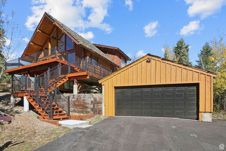 Embraced by the trees of Summit Park, this home captures incredible mountain views and offers a quick and easy access to I-80. The south facing lot provides excellent sunlight throughout the day, a rare find in this neighborhood.Step Inside and you'll find a warm and inviting layout designed for comfortable living. Large windows frame wooded views and fill the home with natural light, while the wood burning fireplace anchors the main living space. The kitchen features an open flow into the dining and living areas-ideal for both quiet nights at home and casual entertaining. The two main level bedrooms provide plenty of space for guests, a home office, or flex use. The upper level is a great option for a peaceful primary suite, surrounded by nature through the abundance of windows, including a private bathroom. Step outside onto the main level deck to enjoy peaceful mornings with wildlife passing through or star-filled evenings in crisp mountain air. The walkout lower level features two more bedrooms, a bathroom and a second kitchen to expand the possibilities. Whether you envision a private guest suite, a rental opportunity, or a dedicated space for entertaining and activities, the layout offers flexibility to suit a variety of needs. The oversized two-car garage offers abundant storage for vehicles, outdoor gear, and more. Whether you're a skier, hiker, or simply love the outdoors, this location makes it easy to live the mountain lifestyle while still staying connected.Perfectly situated for an easy commute to Salt Lake City, world-class skiing, and just 30 minutes from Salt Lake International Airport. Don't miss this opportunity, call to schedule your showing today.