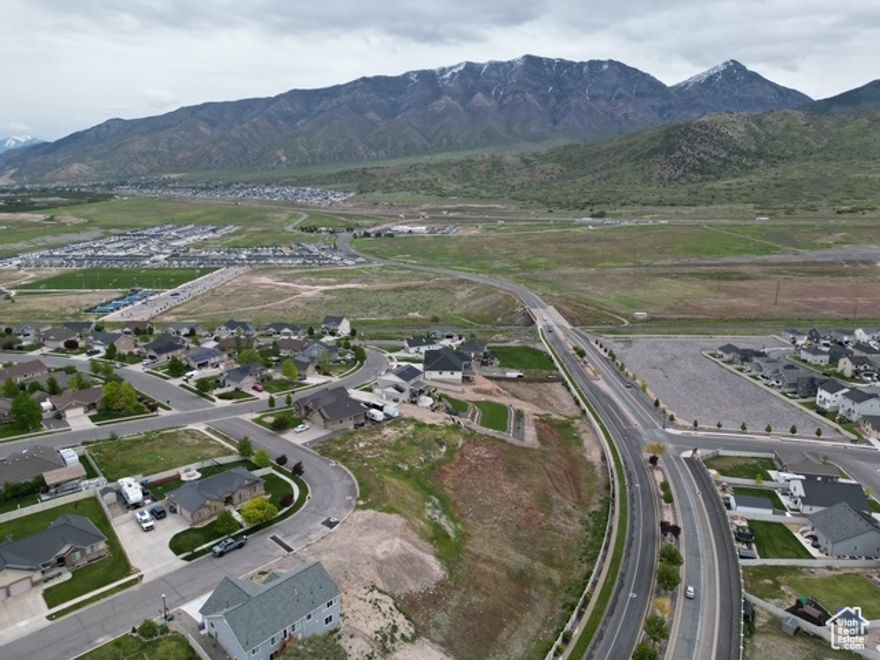 Discover the perfect opportunity to build your dream home on this spacious 0.33-acre lot in the charming community of Santaquin, Utah. Nestled in a peaceful neighborhood with stunning mountain views, this property offers the ideal blend of small-town tranquility and modern convenience. With easy access to I-15, you're just minutes away from shopping, dining, and outdoor recreation, including hiking trails, parks, and Utah Lake. Utilities are available at the street, making this lot ready for your custom build. Whether you're a homeowner or investor, this is a rare find in a growing area. Don't miss out on this beautiful slice of Utah!