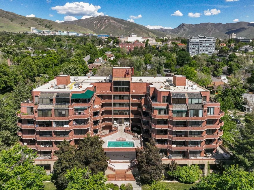*** WALK TO UNIVERSITY OF UTAH *** Location, light, and views make this condo truly special. Perfectly situated within walking distance of the University of Utah and just minutes from downtown and 9th & 9th, this is an ideal spot for student housing, a smart rental investment, or a great place to call home. The flooring, paint, and kitchen are all brand new. The south-facing unit provides natural light year-round, and two sliding glass doors open to a private patio with sweeping views of the valley, the Oquirrh Mountains, and downtown. Watching the sun set from the balcony might just become your new favorite hobby. Inside, you'll enjoy the convenience of an in-unit washer and dryer and a covered parking stall. The building also offers great amenities, including a secure entrance, pool, hot tub, gym, sauna, and clubhouse. Whether you're looking for a convenient place to live or a solid investment, this condo delivers on every level.