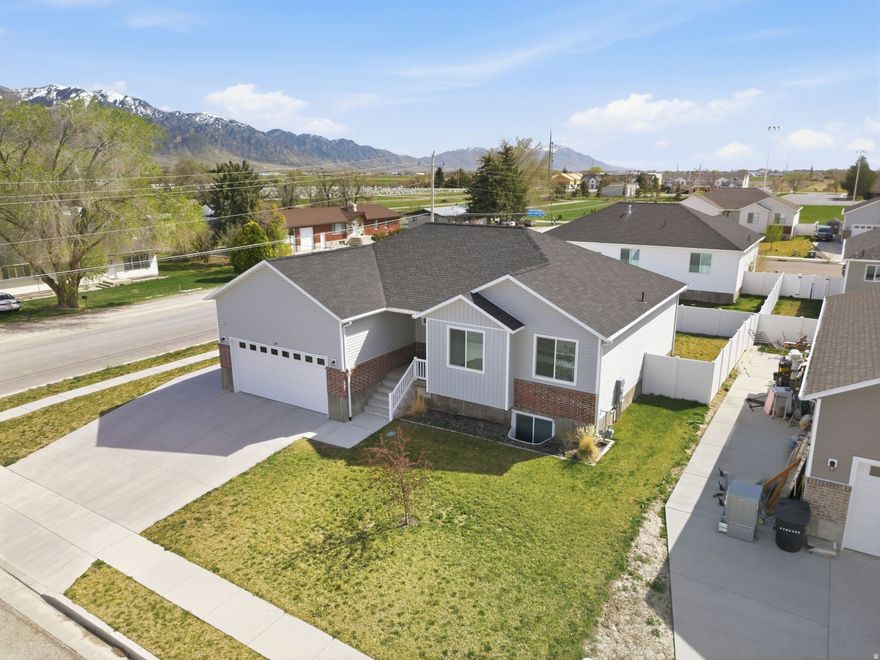 Beautiful 5-bedroom, 3-bathroom home in Tremonton featuring an open-concept layout and spacious bedrooms. Fully finished basement offers additional living space, while abundant storage includes multiple closets and garage storage. Enjoy a stunning kitchen, scenic views, a fully fenced yard with deck and patio perfect for entertaining. Situated on a desirable corner lot with RV parking.