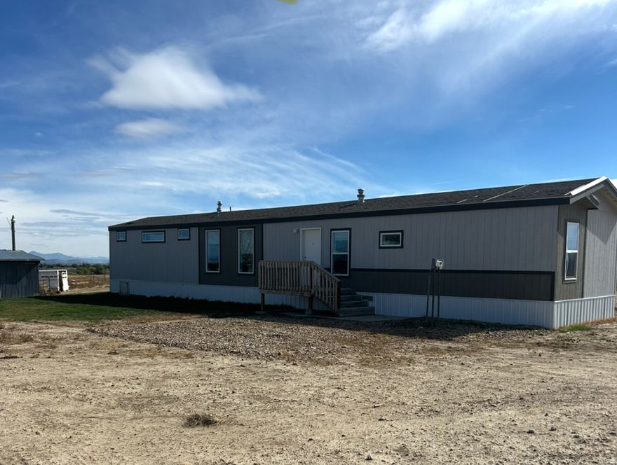 Discover peaceful country living on this spacious 10-acre property featuring a 2019 3 bedroom, 2 bath manufactured home with everything you need for comfort, space, and self-sufficiency. Located in the quiet town of Cleveland, UT, this property offers room to spread out, grow, and live the rural lifestyle you've been dreaming of. Inside the home, you'll find an open and inviting layout with a cozy living area and a functional kitchen with plenty of cabinet space. The master bedroom includes its own private ensuite, offering a relaxing retreat away from the rest of the home. Two additional bedrooms and a second full bath provide plenty of room for family, guests, or a home office. Outside is where this property truly shines. The 10 acres give you endless possibilities-horses, livestock, gardening, or future expansion. The 5-stall horse barn is perfect for equestrian owners! With 18 A water shares included, you have the resources to maintain pastures, irrigate, or support agricultural use. Whether you're looking for a hobby farm, horse property, or a peaceful rural homestead, this property offers the ideal blend of comfort and country living.