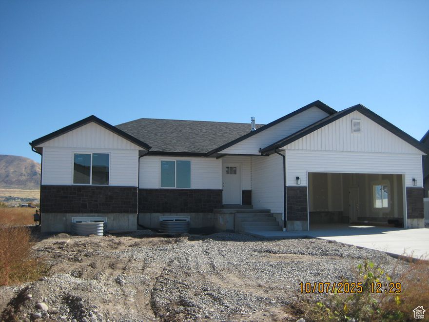 Beautiful new home, sits on .35 acre lot, great mountain views from back patio, desirable West facing home,  located in a new subdivision, tons of extras, granite counter tops, walk in closets, covered patio, 3 bedrooms 2 full baths, unfinished basement. Lot will have rough grade, Taxes  not accessed yet.