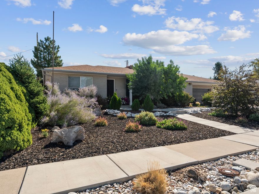 Stylish and fully updated, this 5-bedroom, 2.5-bath home is designed for modern living. The open main floor features spacious living and dining areas with a cozy two-sided gas fireplace, plus a primary bedroom with an ensuite and office space. Outside, the xeriscaped front yard adds curb appeal with low maintenance. Out back, enjoy a fully fenced, immaculate yard with a covered patio, fireplace, dining area, and a large shed with future potential. Move-in ready and perfect for gathering, entertaining, and everyday comfort.