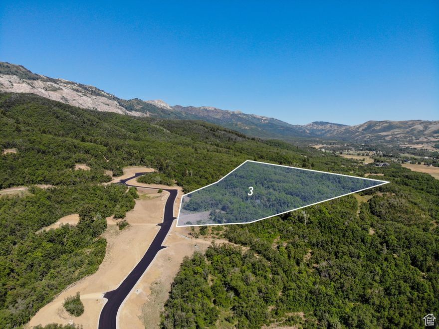 Settled within the Wasatch Mountains overlooking the expansive Ogden Valley, welcome to Arrowleaf. A new, luxury development fit for those searching to find the perfect place to live amongst all the area has to offer. Comprised of only nine building sites, this community-focused development is designed to give owners plenty of space to build their dream home, while not feeling overwhelmed with multiple neighbors and traffic. Each lot is between 5.25 to 8.5 acres in size, and is surrounded by lush forest and natural vegetation. Although tucked away in the mountains, owners will still have access to utilities, including high speed internet. Lot three is near the top of the development and features panoramic views of James Peak, Durst Mountain, Nordic Valley Ski Resort, and the entire valley floor. It's 5.26-acres offers the flexibility to have a large home, detached garage or barn, and fencing, while not compromising views. Arrowleaf allows property owners to have horses if desired, and is in close proximity to North Fork park, Powder Mountain, Snowbasin, Pineview Reservoir, and more. All while being an hour from the Salt lake international airport, 15-minutes from North Ogden, and 30-minutes from Ogden's historic 25th street. With such a limited number of lots available, don't miss out on the opportunity to own your own mountain retreat!