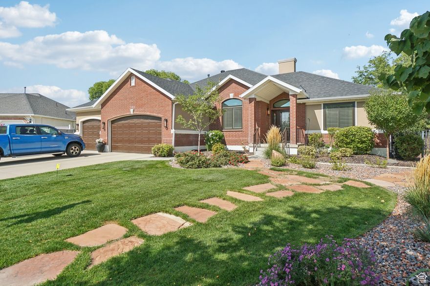 Welcome to this beautifully maintained home, thoughtfully updated with high quality upgrades inside and out! Enjoy peace of mind with a new roof (2023), new windows and screens (2024), tankless water heater (2024), and a brand-new gutter and leaf guard system (2025). The exterior also shines with new home lighting (2025) and gorgeous landscaping in both the front and back yards. Inside, you'll find custom lighting throughout, custom window coverings and shades, and expansive windows that fill the home with natural light. A detached 4th oversized garage with a built-in workbench provides the perfect space for projects, hobbies, or extra storage. This home blends modern updates, functional features, and timeless charm ready for you to move in and enjoy!
