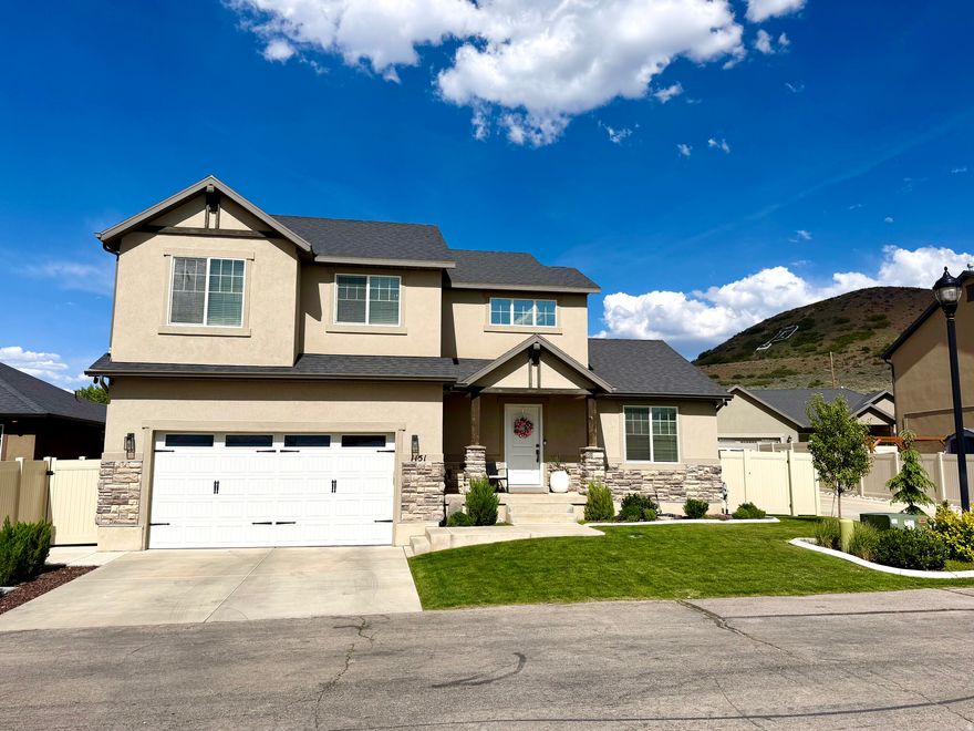 Welcome to this beautifully maintained 4-bedroom, 2.5-bath home nestled near the entrance to Payson Canyon, offering quick access to some of the area's best outdoor recreation including hiking, biking, camping, and scenic trails. Just around the corner, a nearby walking path leads directly to a local park, adding even more convenience and enjoyment to the location. While the home is close to shopping, dining, schools, and freeway access, it still offers a peaceful setting with beautiful mountain views and a more tucked-away feel. Inside, the home features multiple vaulted ceilings in the entryway, living room, and primary bedroom, creating an open and spacious atmosphere throughout. Recent updates include new flooring, carpet, and appliances, giving the home a fresh and modern feel. The primary suite includes a walk-in closet, soaking tub, and separate shower for added comfort and functionality. The unfinished basement provides an excellent opportunity for future expansion, storage, or customization to fit your needs. Outside, enjoy a backyard patio ideal for grilling, entertaining, or simply relaxing and taking in the surroundings. Included with the sale are the ceiling mounted overhead garage storage racks and the Orbit B-hyve sprinkler controller. Combining comfort, thoughtful updates, flexible living space, and convenient access to both recreation and everyday amenities, this home offers a wonderful opportunity to enjoy all that the area has to offer.  Square footage figures are provided as a courtesy estimate only.  Buyer is advised to obtain an independent measurement.