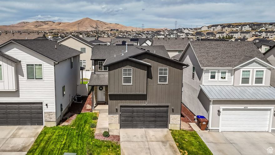 Your first two years of home-ownership just became more affordable! Seller offering 2/1 interest rate buy down with full price offer. ($13k in concessions)  Discover your new home where quality craftsmanship meets thoughtful design in Eagle Mountain's thriving community. This impressive 4 bed, 3.5 bath 2 story showcases exceptional attention to detail throughout every corner.  The heart of this home features an inviting open floor plan that seamlessly connects living spaces, making it perfect for both daily family life and entertaining guests. The kitchen serves as a true centerpiece with elegant Silestone countertops that resist stains and scratches while providing a stunning work surface. Soft-close shaker cabinets offer abundant storage with a whisper-quiet operation that prevents those midnight snack raids from waking the household. Stainless steel appliances complement the modern aesthetic while promising years of reliable performance.  Durable luxury vinyl plank flooring flows throughout the main living areas, providing the beautiful appearance of hardwood with enhanced durability and easy maintenance. A generous walk-in pantry ensures you'll never run out of space for culinary essentials, whether you're a weekend chef or a meal-prep enthusiast.  The primary bedroom suite transforms bedtime into a retreat experience with its spacious layout and luxurious ensuite bathroom. A huge walk-in closet accommodates extensive wardrobes, while the double vanity provides morning routine harmony for couples. The cultured marble shower adds spa-like elegance to daily routines.  Upstairs, the thoughtfully designed loft creates versatile space for a home office, entertainment area, or children's play zone. Three additional spacious bedrooms ensure everyone has their own comfortable sanctuary. The second-floor laundry room eliminates the hassle of hauling baskets up and down stairs, making weekly chores surprisingly manageable.  The fully finished basement significantly expands your living space, offering endless possibilities for recreation rooms, home gyms, or additional bedrooms. This lower level represents exceptional value, essentially providing a second home within your home.  This neighborhood offers outstanding convenience with Ridley's Family Markets just minutes away for grocery needs. Golf enthusiasts will appreciate proximity to The Ranches Golf Club, where weekend rounds become effortless escapes. Families benefit from nearby Sunrise Park and Cory Wride Memorial Park, providing recreational opportunities for all ages.  Eagle Mountain represents Utah's fastest-growing communities, combining small-town charm with modern amenities. The area provides excellent schools, safe neighborhoods, and stunning mountain views that remind you daily of Utah's natural beauty. Also conveniently located near Mountain View Corridor and the Pony Express Parkway to ease your commute.  This home offers the perfect balance of luxury features, practical design, and prime location. Whether you're starting a family, expanding your current household, or seeking a forever home, this property delivers on every expectation.