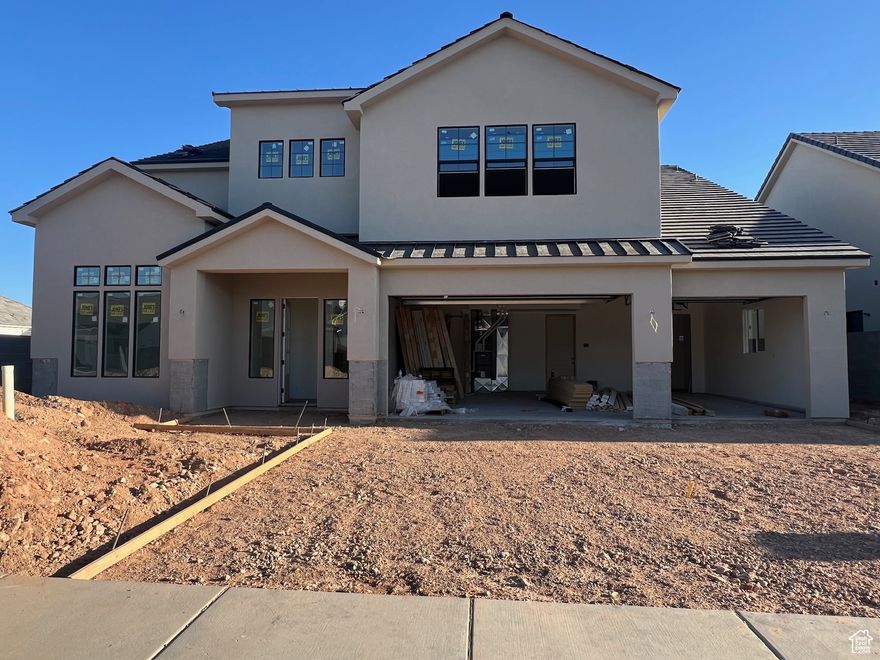 Almost finished! 6 bedrooms + an office/den, mud bench just inside from the 3-car garage, huge media room/loft, privacy block walls on 3 sides, huge covered patio to enjoy evening shade, 10ft ceilings on the main level with 8ft tall doors, tankless water heater, rain gutters, custom cabinets, quartz countertops, tiled showers, primary bedroom on the main level with a beautiful bathroom suite with a walk-in-closet, double vanities, soaker tub, and gorgeous shower, stainless steel appliances including the refrigerator, nice pantry, builder warranty, Dixie Power District. All information is deemed reliable but not guaranteed, buyer to verify all.