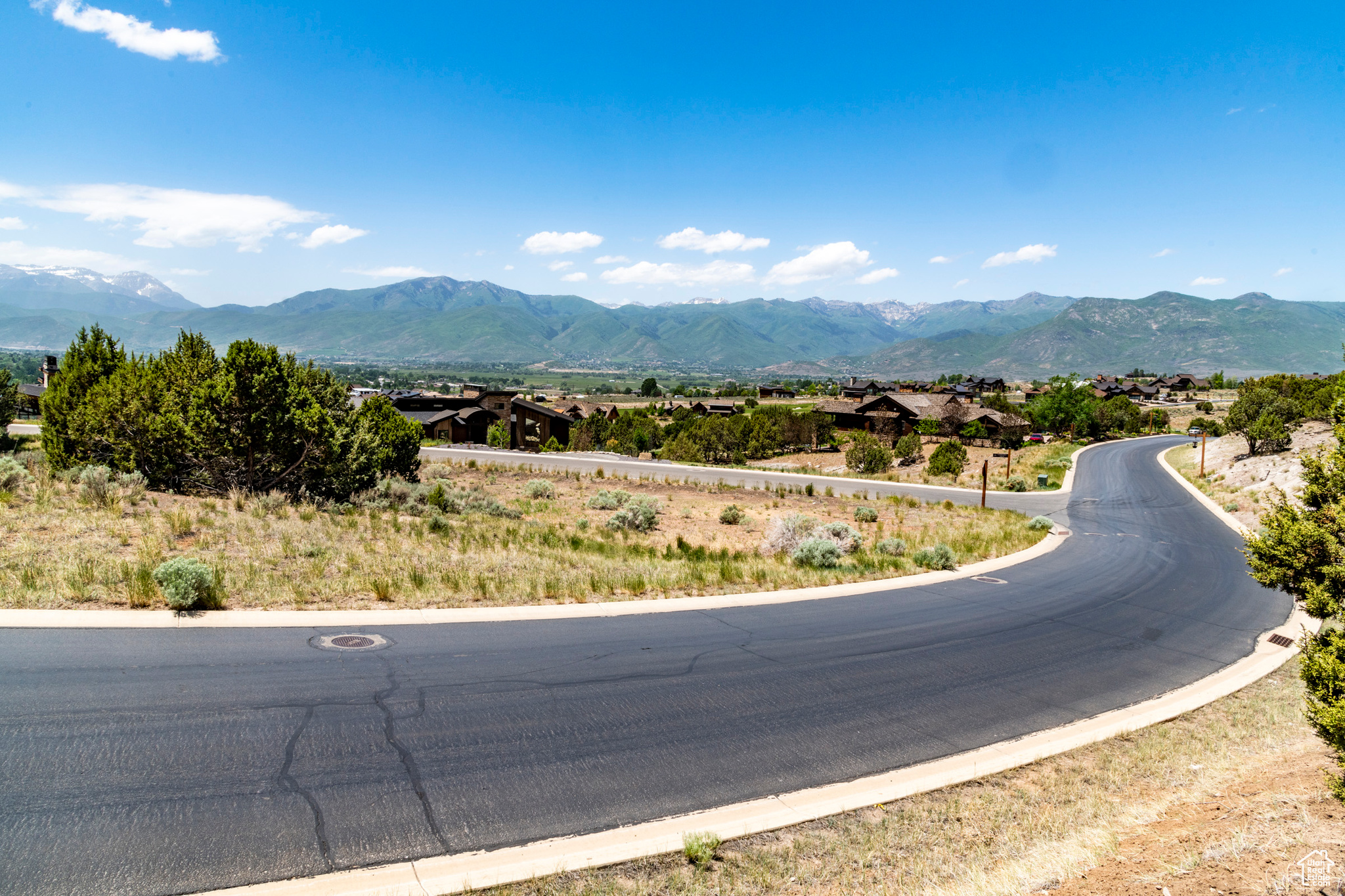 Large 2 plus acre lot with incredible views of the mountains and the Heber Valley.  Red Ledges is an amazing community with great amenities including two pools, a workout facility, a club house, tennis courts, pickleball courts,  equestrian center, hiking and biking trails and much more.