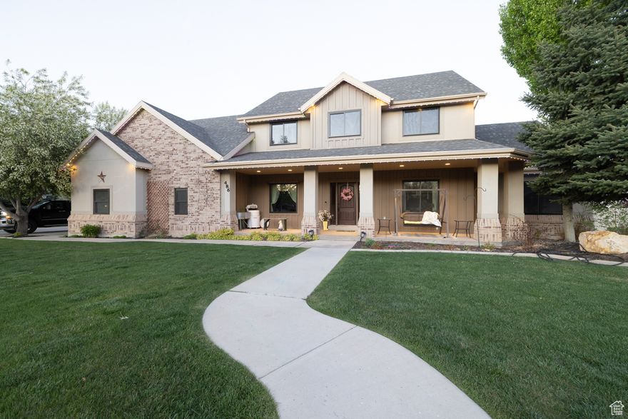This darling 3704 sq ft home sits on a beautifully landscaped 0.94-acre lot and offers 6 bedrooms, 4 bathrooms, and all the space you've been looking for. The spacious kitchen opens to a large dining and family room, perfect for entertaining or everyday living. Outside features an in-ground BBQ, permanent exterior lighting that adds a beautiful touch year-round, and a 40x40 shop ideal for hobbies, storage, or extra workspace. Shop has a Bathroom. Recent updates include brand-new windows throughout and a new tankless water heater for energy efficiency and comfort. With its charming design, thoughtful upgrades, and incredible outdoor features, this home is the total package.  Please give 24 hours notice for all showings as Seller works from home.  Square footage figures are provided as a courtesy estimate only and were obtained from County Records.  Buyer & Buyers agent are advised to obtain an independent measurement & verify all information.