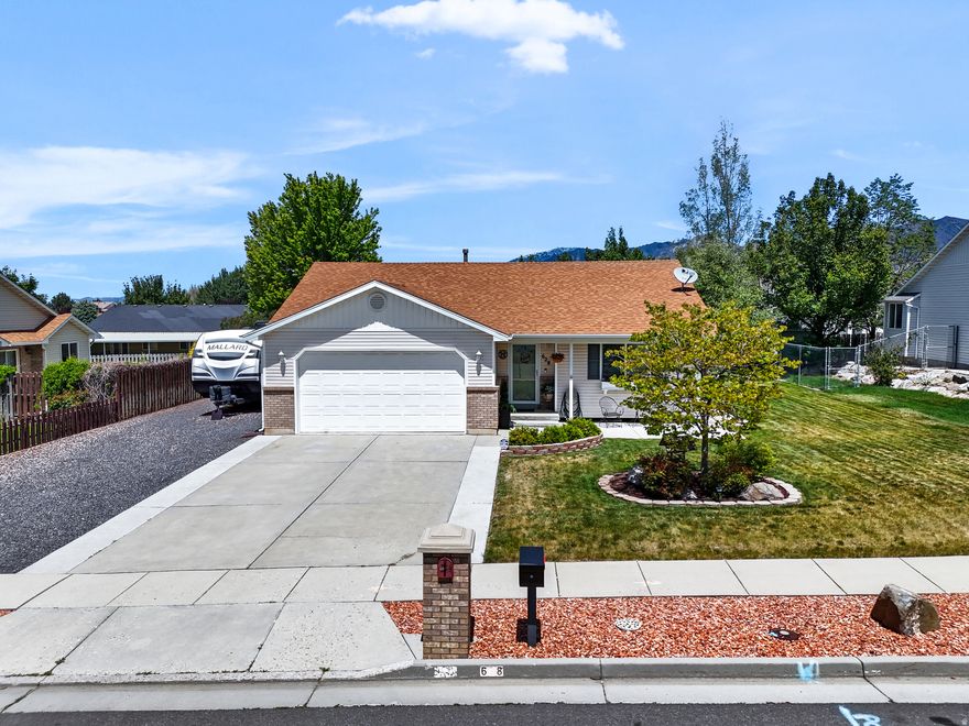 ONE LEVEL LIVING on the east of Perry with low maintenance yard and no HOA fees! You'll love entertaining in the spacious living room and kitchen area. Outside a hot tub and awning covered deck. The side yard has RV parking and the backyard workshop is great for tinkering.  This 2 bedroom 1 bath home with attached garage could be yours... because the price is right!