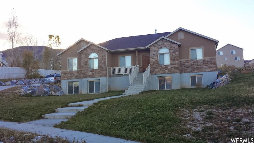 This home has great views of the mountains and lake. Enjoy the large lot that is great for many toys and great ideas. The long driveway can fit many vehicles. Call agent to schedule a showing.