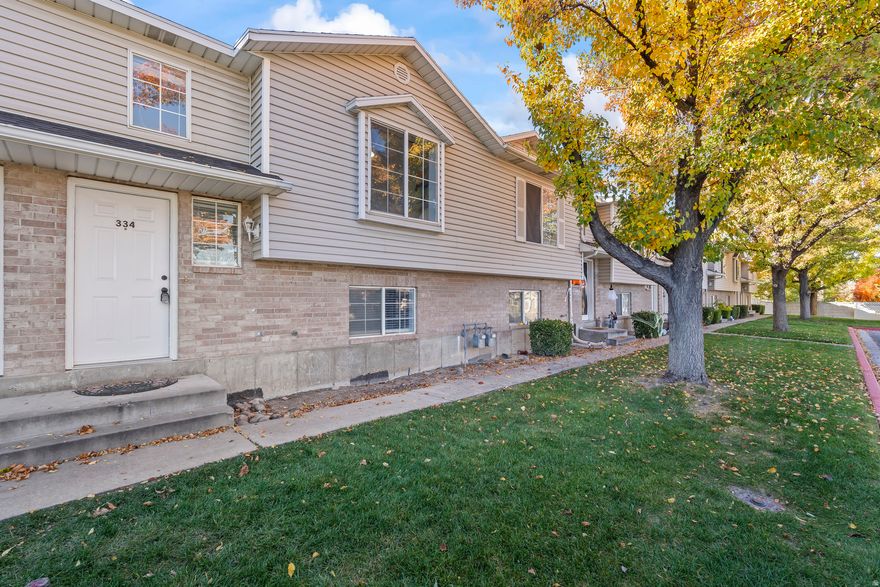 Just reduced $5K! *3D Tour* + *Open House 12/6 Saturday from 12-2 PM* + *1% Preferred Lender Incentive Available (Closing Costs/Rate Buy Down)* Beautifully updated & move-in ready in downtown Spanish Fork! Enjoy maintenance-free living with your fully-fenced backyard & landscaping handled by HOA. Prime walkable location near dining, shopping & entertainment. New AC & furnace (2022), roof replaced (2019, HOA covered). All stainless-steel appliances (2024) + washer & dryer included. Playground & picnic areas perfect for relaxing in this quiet well-kept community. Modern elegance with new LVP flooring, new carpet, freshly painted rooms, and ceiling fans (2023). Enjoy the open-concept layout with 3 bedrooms and 1.5 bathrooms, featuring vaulted ceilings in the primary bedroom, abundant storage & walkout basement for easy indoor/outdoor living. 2 reserved parking spots included: 1 covered/1 uncovered. This home offers a lifestyle of convenience. Right across the street from: Costco, Macey's Grocery, Restaurants, City North Park & Splash Pad, and nearby Walmart, Target, Cinemark Theater, VASA Fitness, Spanish Fork Canyon. Quick freeway access & 15 minutes from BYU/UVU. Come see why this is one of Spanish Fork's best values! - Buyer/Buyer's Agent to verify all. Square footage figures are provided as a courtesy estimate only and were obtained from county records. Buyer is advised to obtain an independent measurement.