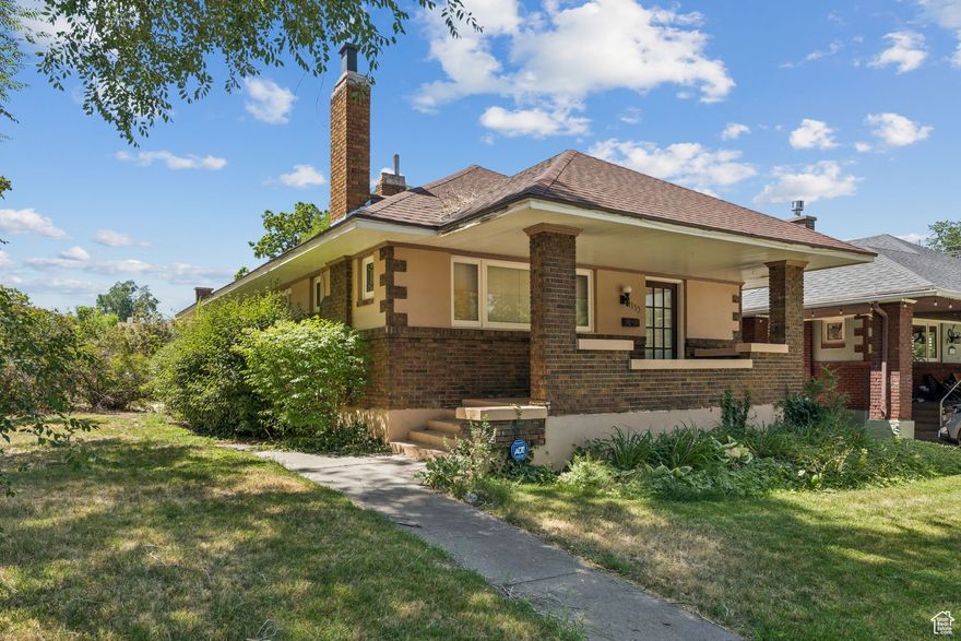 Step into timeless charm with this 1922 Craftsman brick bungalow, perfectly blending historic character with comfortable living. Located near the Eccles Historic District and Weber State University, this home is filled with original details, warm wood finishes, and vintage quality not found in new construction.  Beautiful hardwood floors, solid wood trim, and original stained glass windows add warmth and elegance. The inviting living and dining areas are perfect for gatherings, with abundant natural light streaming through wide windows framed in solid dark wood. Built-in shelving and bookcases offer both storage and display space, adding to the home's classic character.  This property offers more than just charm - it's a smart investment. With strong bones and original details intact, updates will immediately increase its value and livability. Potential for a third bedroom and family room downstairs which already has a full bath. Whether you're a homebuyer seeking historic character or an investor looking for a renovation opportunity, this home delivers. Already set with a new Central Air System, Water Heater (both installed in 2024), and a newer furnace (only 3 years old)!  This home's solid craftsmanship is evident in every detail. Located near Ogden's vibrant downtown, shopping, dining, and parks, this bungalow offers the perfect combination of history, character, and convenience. Square footage figures are provided as a courtesy estimate only and were obtained from tax records.  Buyer is advised to obtain an independent measurement.