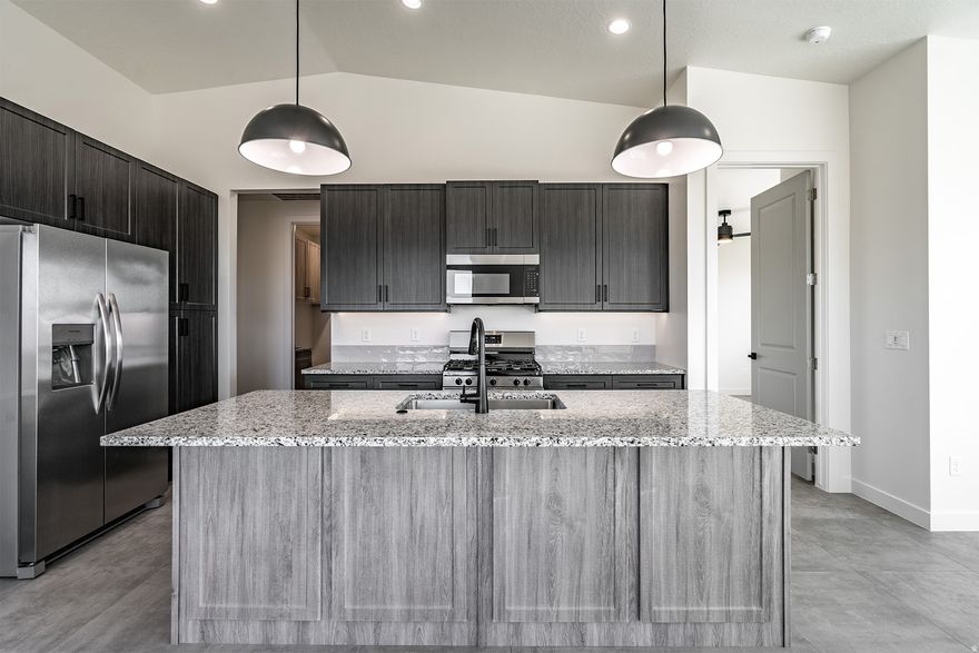 The Aurora - This well-designed 2-bedroom, 2-bath home offers modern living with an open-concept layout connecting the spacious great room and stylish kitchen. Features include thermofoil cabinetry, granite countertops, a single-bowl stainless steel undermount sink, and a Frigidaire stainless steel appliance package with electric range, microwave hood, dishwasher, and refrigerator. Interior finishes include two-tone paint, tile flooring in main living areas, carpet in bedrooms, can lighting throughout, and ceiling fans in the living room and bedrooms. Bathrooms feature Moen plumbing fixtures and custom tiled showers/tub surrounds. Additional highlights include a laundry room with sink cabinet, extended finished garage with 50-amp EV breaker and room for a workshop or toys, block walls, and backyard space. Community amenities include a pool, hot tub, pool house, pickleball court, playground, and RV parking.  Home must be under contract by January 15, 2026, to qualify at this pricing. Builder offers no upgrade costs all finishes and features shown are included as the builder's standard. Every detail comes upgraded, providing exceptional value with premium selections already built in.