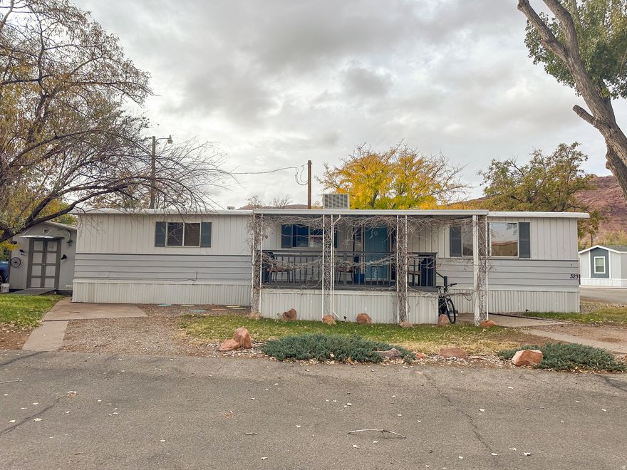 Don't miss this extra clean 2 bedroom 2 bath 1972 double wide trailer in excellent condition with a spacious covered deck near the north entrance of Grand Oasis. The home has been completely reconstructed - walls, insulation, electrical, and plumbing and there is a new water heater, furnace and air conditioner. There are two parking spaces, a grassy area, and a shed for storage. The community includes a playground, basketball court, pool, laundry, fitness center, and a clubhouse to rent for events. All park rules apply. Space rent is $700.00 which includes garbage and water. Purchase of the property will require a valid social security number. See attached documents for application. Square footage figures are provided as a courtesy estimate only and were obtained from owner. Buyer is advised to obtain an independent measurement. MOBILE HOME SALE ONLY, NO REAL ESTATE INCLUDED.