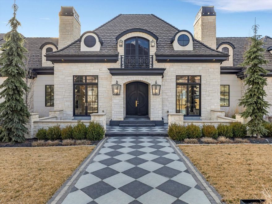 Spectacular living awaits on Alpine's East Bench, where expansive Utah Valley and sunset views from spacious entertaining areas flow into breathtaking mountain vistas from the pool and spa. This home delivers it all-an indoor basketball and pickleball court, a home theatre, a mirror-walled dance and workout space, plus a chipping and putting green. The pool's open-air casita and slide add to the fun, creating an elevated living experience for the whole family. The main floor primary suite boasts its own private deck with a hot tub and more sunset views. Extra-high, deep, heated garage spaces offer plenty of room for daily drivers, weekend cruisers, and toys, all surrounding two large gathering spaces perfect for family and friends. **Property sold "As-is". Buyer and/or buyer's agent responsible for verifying all pertinent information deemed relevant by the prospective buyer, including but not limited to square footage, acreage, utilities, taxes, zoning, permitting, condition, school zones, HOAs, etc.**