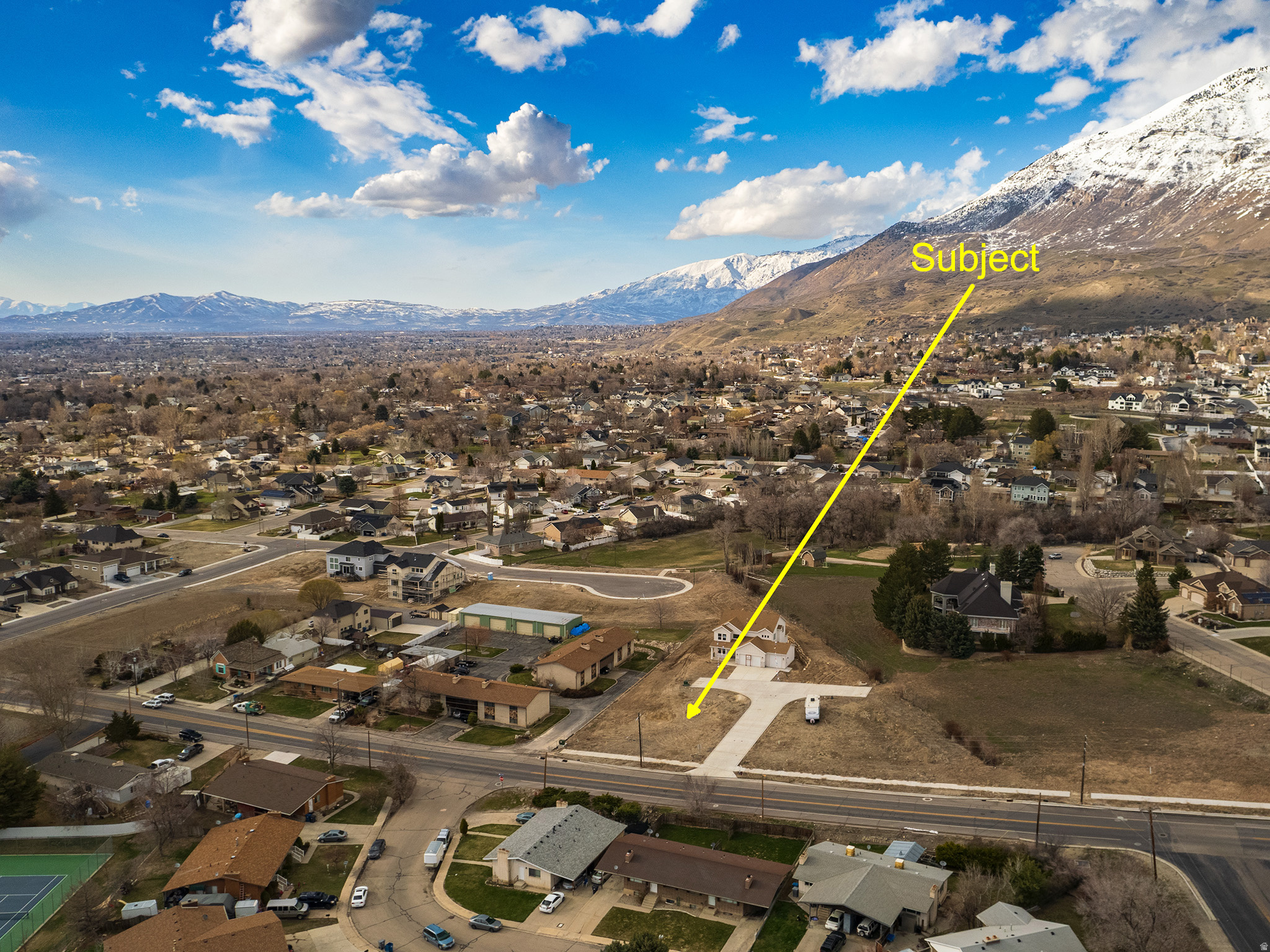 Aerial perspective showcasing the residential area with a prominent mountain backdrop