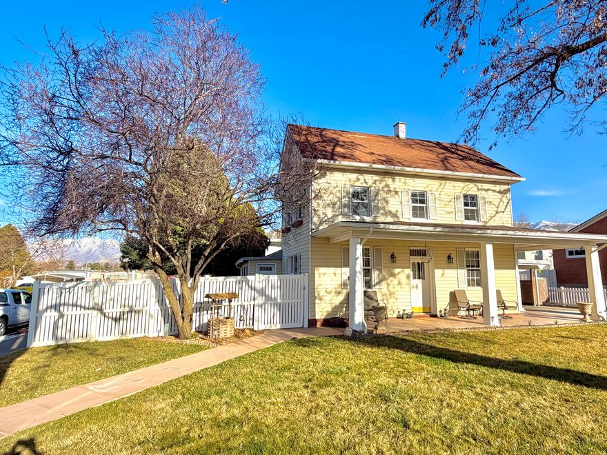 Historic Payson Charm with Modern Updates. This beautifully maintained turn-of-the-century home blends timeless character with thoughtful updates throughout. The interior features refreshed paint, updated flooring, multiple living spaces, and a comfortable, versatile layout that makes the home feel both inviting and functional. Recent improvements provide peace of mind, including updated windows (20162020), furnace and central air, New water heater, attic insulation, roof maintenance, and fiber-optic readiness. 220V Hot tub connection. The kitchen features quartz countertops and modern appliances, along with updated lighting and fixtures that complement the home's historic charm.The large backyard is a true highlight, offering mature shade trees, fruit trees (peach and nectarine), grapevines, patio lighting, a misting system, and hummingbird feeders. Outdoor amenities include a sprinkler system, fencing, garden shed, storage shed, covered carport storage, and recent concrete work on the driveway, patio, and sidewalks.Located close to Payson Canyon, lakes, parks, and beloved local events like Onion Days, this one-of-a-kind property offers historic character, modern updates, and an outdoor setting that's hard to find.