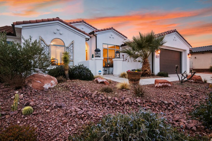 Stunning extended Amethyst model offering over 3,000 sq ft with 4 bedrooms, 4 baths, plus bonus theatre/bunk room. Situated on the largest lot in the subdivision ( acre) with breathtaking golf course and mountain views. Designed for indoor-outdoor living with a 4-panel sliding glass door opening to a resort-style backyard featuring a 9-ft deep pool with diving board, rope swing, sun shelf, swim lane, fire pit lounge with TV, putting green, expansive lawn, outdoor shower, and space for a future outdoor kitchen. Dual gates provide golf course and gully access. Gourmet kitchen with generous dining space. Luxurious owner's suite with spa-style bath, oversized shower, soaking tub, dual vanities, and large walk-in closet. Additional features: Tesla solar panels with Powerwall backup, 2 EV plugs, Instant hot water, landscape lighting, outdoor speakers, RV parking, and 3-car garage. Private resort living in one of the community's most desirable locations.