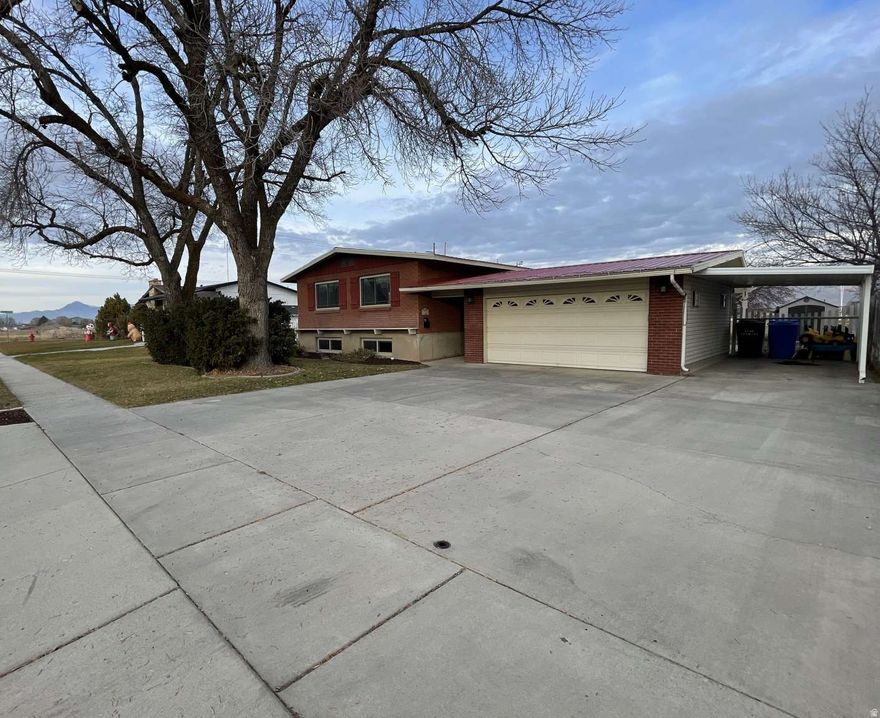 Well-Maintained 4-Bedroom Home in Tremonton This solid and well-cared-for 4-bedroom, 2-bath home offers 2,050 square feet of comfortable living in a mature Tremonton neighborhood. Built in 1961, the home reflects consistent maintenance and dependable construction.  The kitchen and both bathrooms have been updated and are highly functional, offering efficient layouts, good storage, and a clean, timeless feel. Further significant improvements provide added peace of mind, including a durable metal roof with substantial remaining life, and a sewer line replacement completed in 2022.  Outside, the manageable 1/6-acre lot allows for versatile use and easy upkeep with a detached two-car enclosed garage, two standalone sheds, a chicken coup, and multiple raised garden beds.  This move-in ready home is an excellent opportunity for buyers seeking space, reliability, and value in Tremonton.
