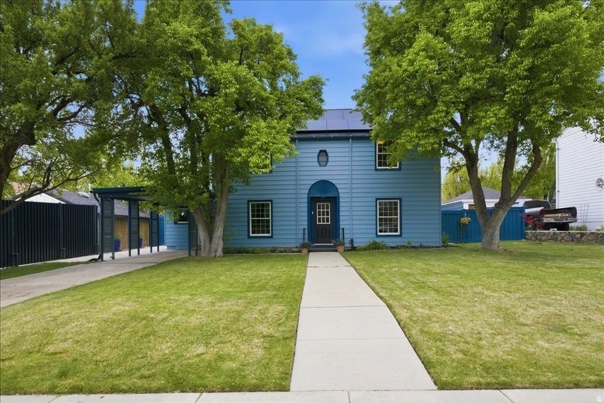 Situated on an expansive .23-acre lot in Yalecrest, this classic 1940s home offers a prime location and significant scale. Whether you're interested in restoring a vintage gem or capitalizing on the large footprint in a sought-after neighborhood, the opportunity here is unmatched.  The traditional layout and character are intact with original wood floors and the upper level hosting a hard-to-find three bedrooms and two bathrooms. A primary suite on the main level consists of a spacious bedroom, an en suite, and access to the patio.  Impressive sustainability-focused updates have completely eliminated natural gas: a solar array (paid-off in full), mini split heating and cooling system, and an EV charging station. The roof was replaced in 2018 and upgrades have been made to the plumbing, including an electric water heater.  Positioned on a vibrant street with quick connections to the heart of the city, just minutes from the University of Utah and downtown. Walking distance from parks, excellent schools, a public library, Harmon's Emigration Market, and locally-owned restaurants.