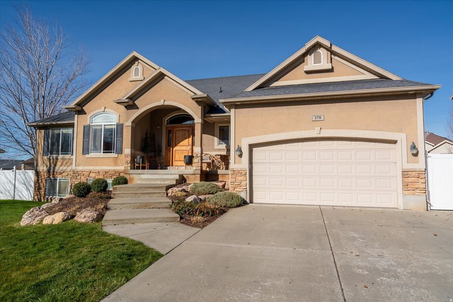 Experience comfort, style, and thoughtful updates in this beautifully maintained 6-bedroom, 3-bath North Ogden rambler. The spacious open-concept layout features a large great room anchored by a stunning custom built-in fireplace-the perfect backdrop for cozy winter evenings and memorable holiday gatherings.  Enjoy peace of mind with recent upgrades, including an updated HVAC system and water heater, along with the modern finishes and functionality today's buyers appreciate. The single-level living design offers convenience, while the fully finished basement provides additional space for entertaining, hobbies, or guests.  Nestled in a desirable North Ogden location surrounded by mountain views, this home blends comfort, quality, and warmth in every detail. Don't miss the chance to make it yours.