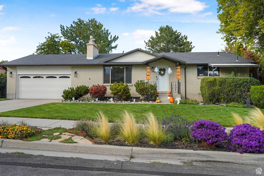 Welcome to this beautiful home in a highly sought-after location offering both comfort and versatility. The main level features real wood floors, stone countertops in the kitchen and bathrooms, and a cozy terrazzo mantel and hearth. You'll love the brand new windows that fill the space with natural light and perfectly frame those stunning mountain views-right from your kitchen sink. The updated kitchen includes new stainless appliances dishwasher, stove, and fridge and an induction range for precise cooking. Upstairs also includes W/D hookups, a new entry and storm door, and Google Fiber  *Downstairs you'll find a separate apartment with a hidden entrance w/ potential rental income. The basement includes a full kitchen with new stove and fridge, brand-new LVP flooring, and its own laundry area. Enjoy peaceful evenings on the covered back patio or take in the view from the water-wise landscaped yard and park strip. The automatic sprinkler system keeps everything looking great with minimal effort. All of this is in an unbeatable location with quick access-less than 10 minutes-to I-15, I-215, and Bangerter Highway. Come see this gem for yourself-homes like this with separate living space, mountain views, and such thoughtful updates are hard to find.