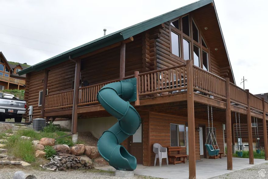 Bear Lake Genuine log home in Harbor Village, Garden City, Utah Built in 2004 Overlooking the State marina with a gorgeous view of Bear Lake! Perfect for personal use as well as VRBO rental. Income potential of $100,000 plus per year (we have rented from June 20 - August 15 each summer and generated around $40,000, then used it personally the rest of the year) Sleeps 32 in beds (including sofa type sleepers) 6 bedrooms, 3 full bathrooms, new hot tub, slides and swings, Weber grill & Blackstone griddle, 4 arcade games, air hockey, foosball, theatre set up Beautiful log beds Fully furnished, two fridges (two ice makers), 4 Lifetime picnic tables Double sets of sheets and towels Kitchen fully stocked with appliances, utensils, plates, bowls and glasses Long life metal roof New on demand Rinnai water heater & water softener Washer and dryer 5 years old Carpets and tile replaced within last 4 years AC Gas fireplace