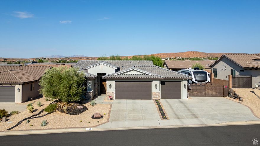 A dog-gone dream! Set on one of the largest lots in Brio, this home features RV parking plus a third-car space, and a fenced ''doggy dream yard'' complete with a pergola, tuff shed with A/C and heat, pet wash station, sandbox and umbrella shade, and even a waterfall pond to keep pets cool and hydrated. The yard is camera-monitored, so you can check on them while you're away. No more stressful boarding! Inside the bright, open layout offers three bedrooms and two full baths, with plenty of space for guests, a home office, or hobbies. Recent upgrades include a newer hot water heater, HVAC, carpet, and new appliances. The RV is also available for purchase. Just a few blocks away, you'll find Brio's resort-style amenities including swimming pools,  hot tubs, tennis, pickleball courts, a fitness center, yoga studio, and scenic walking trails. With easy freeway access, plus nearby shopping, dining, Green Spring Golf Course, and Red Cliffs Desert Reserve, this home puts you in the heart of Southern Utah's active lifestyle.