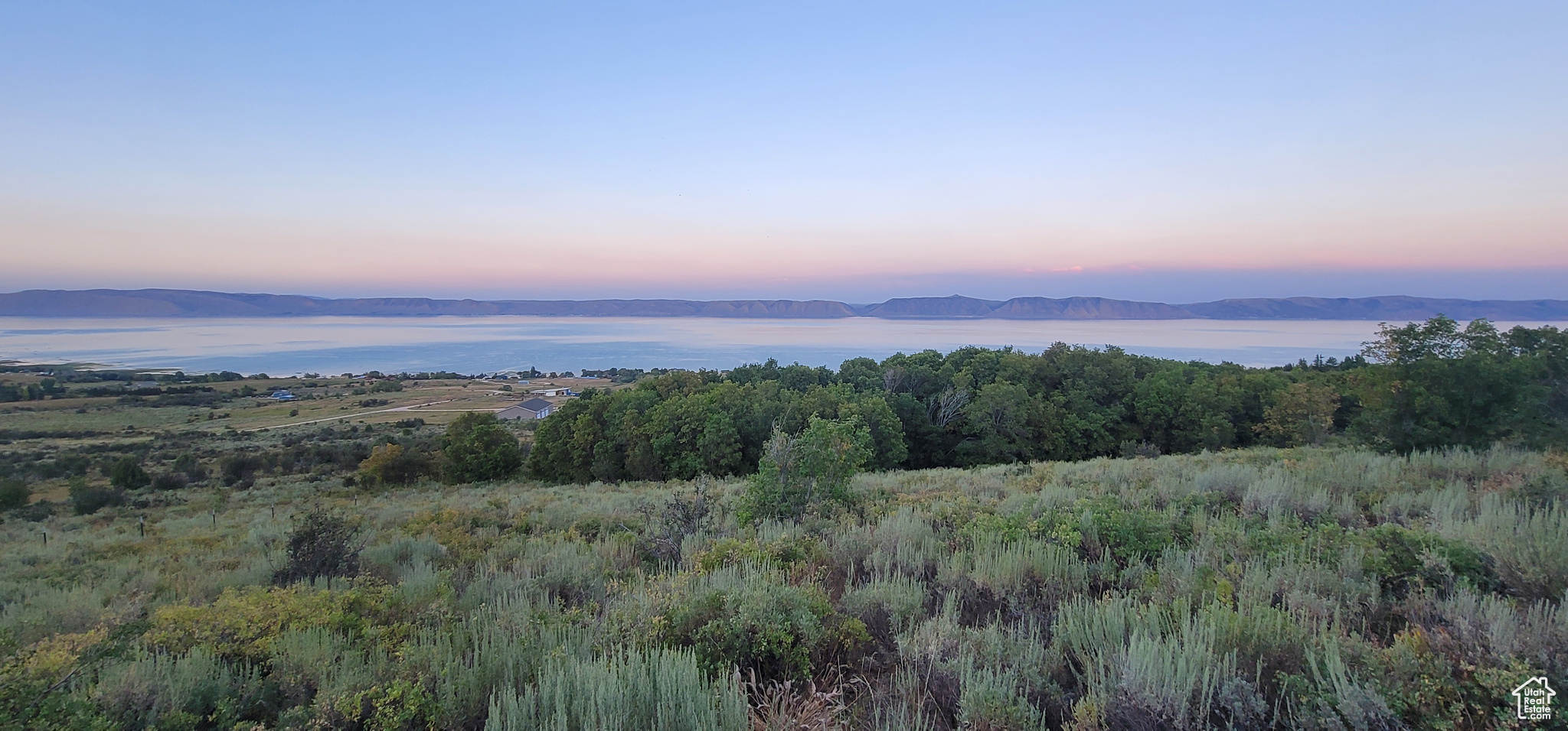 Escape to the quiet beauty of Bear Lake, just across the Idaho border in peaceful Fish Haven. This rare piece of acreage, with no HOA restrictions, offers the freedom to create your perfect getaway. Nestled against the western edge of the property, mature vine maples and native trees provide natural cover for local wildlife, including deer, moose, and sage hens. Wake up to wide-open lake views and colorful sunrises. Breathe in the crisp mountain air, whether you're setting up your RV for a weekend retreat or planning to build your dream home or vacation cabin. Opportunities like this acreage without an HOA and views like these don't come along often.