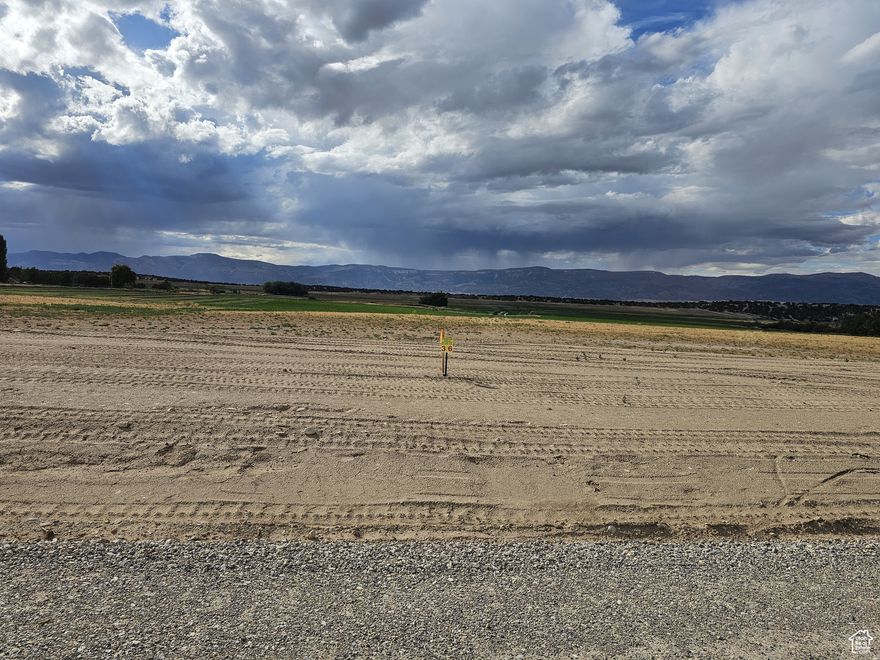 Building lot with views, no HOA, private land, power, water and all usable acreage ready to build on! Set in a former alfalfa field. Get away from it all and enjoy country living in the Sanpete Valley, just south of Spring City, with wonderful views of Horseshoe Mountain and the rest of the Manti La-Sal's. Build your dream home and escape the traffic and noise. Just an hour from Utah Valley and Costco. Fresh clean air and gorgeous star-filled night skies for you to enjoy. Year-round access on a maintained and snowplowed county road. Power is available at the property line through Spring City. Sewer would be a septic system. Water is connected and provided by a shared private well in which you will own your own water. Natural gas is available on 1100 South. Easy access to Spring City Canyon and the National Forest and the 360-mile Skyline Drive trail system for all the fun Mother Nature has to offer. Enjoy all of the small-town amenities within 5 minutes of this property like a hospital, grocery and hardware store, indoor swimming pool and even a drive-in theater. There are additional lots for sale. MLS map is correct and Google Maps/Earth are 39.46253, -111.50453 Buyer to verify all information