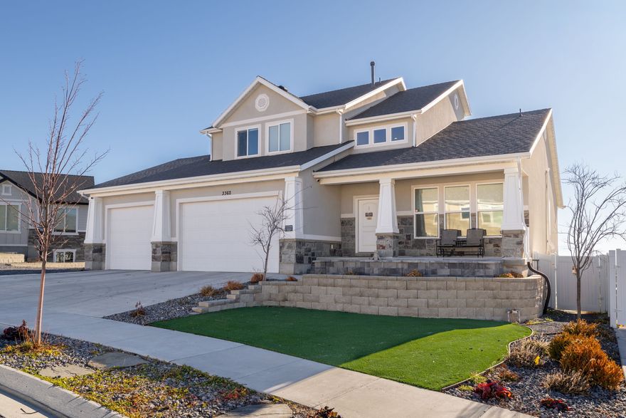 You will love this beautifully crafted semi-custom home on the coveted north side of Cory B. Wride and just minutes away from shopping. Enjoy breathtaking mountain views from the huge deck or covered patio. Homes will never be built behind you, so always enjoy the view!  The basement is newly finished and also pre-wired and plumbed for a future second kitchen - perfect for an apartment or entertaining. The oversized garage offers tall doors, extended depth, EV charging, freezer power, and ample space for hobbies and storage.  Beautiful and low-maintenance backyard with built-in seating walls, reinforced fencing, and a custom dog-wash station. Additional highlights include paid off solar to save you hundreds per month on power, radon mitigation, whole-home water softener, and a drinking water RO system.