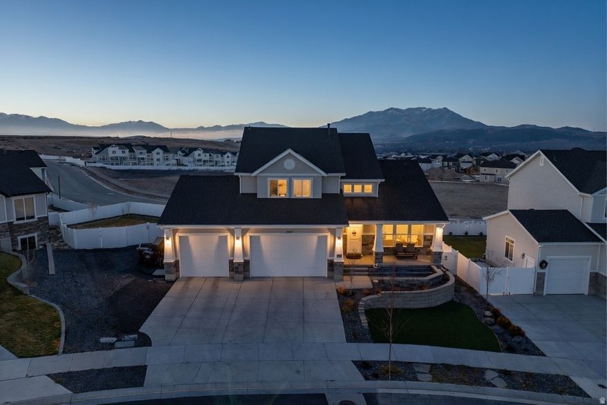 *OPEN HOUSE SATURDAY JANUARY 24th 11am-1pm*  You will love this beautifully crafted semi-custom home on the coveted north side of Cory B. Wride and just minutes away from shopping. Enjoy breathtaking mountain views from the huge deck or covered patio. Homes will never be built behind you, so always enjoy the view!  The basement is newly finished and also pre-wired and plumbed for a future second kitchen - perfect for an apartment or entertaining. The oversized garage offers tall doors, extended depth, EV charging, freezer power, and ample space for hobbies and storage.  Beautiful and low-maintenance backyard with built-in seating walls, reinforced fencing, and a custom dog-wash station. Additional highlights include paid off solar to save you hundreds per month on power, radon mitigation, whole-home water softener, and a drinking water RO system.