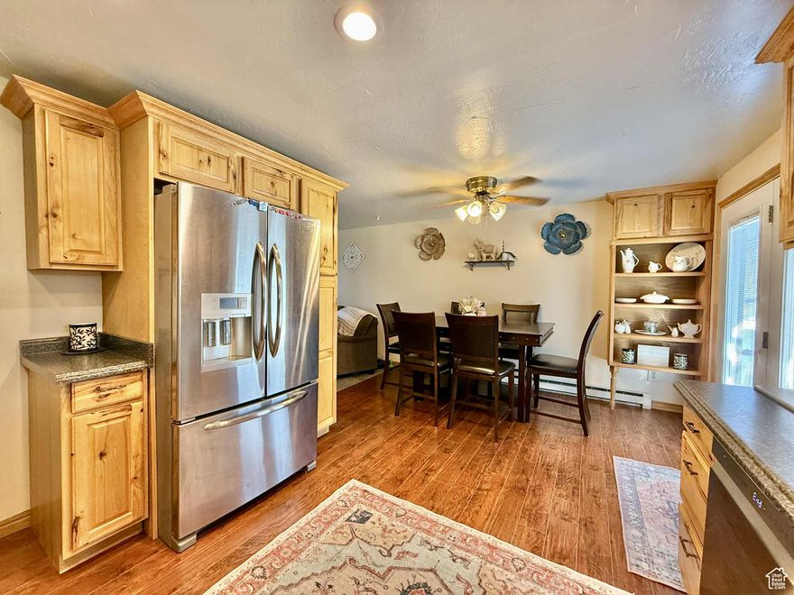 Comfortable and inviting- move in ready, 4 bedroom home is tucked away in established neighborhood.  Newer flooring, appliances, 2 living areas and lifetime metal roof. Fully fenced backyard with large deck for entertaining, full landscaping, and sprinkler system. Room for another full bath in basement!  All information and SF is provided as a courtesy, buyer to verify all.  Thanks!