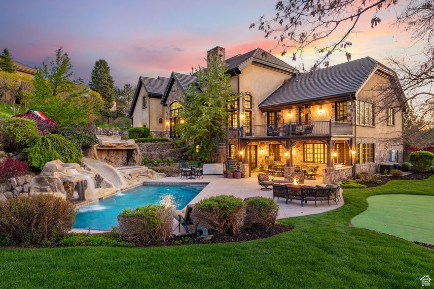 Experience the pinnacle of luxury living in this exceptional estate located in the prestigious, 24-hour guard-gated Pepperwood community. Thoughtfully designed with the finest craftsmanship, this home features expansive mountain views, soaring ceilings on every level, and oversized windows that flood the interior with natural light-seamlessly blending indoor and outdoor living. Most bedrooms in the home include their own en-suite bathroom, ensuring comfort and privacy for all. The spacious main-level primary suite offers a luxurious retreat with a spa-like bath and generous walk-in closet. The true gourmet kitchen is ideal for entertaining, while the walkout basement is loaded with amenities-including a second full kitchen, a large theater room with screen and recliners, a golf simulator, craft room, a full commercial-style gym, and an impressive indoor basketball court with an observation room and wet bar. A secure underground walkway connects to the detached garage, which brings the total to seven heated garage bays-offering ample space for vehicles, recreational toys, or a car collection. Above the detached garage is a fully finished apartment, complete with a bedroom, an en-suite bathroom, and an additional half bath-ideal for guests, extended family, or an upscale home office setup. The private backyard is designed for year-round enjoyment, featuring a swimming pool with slide, in-ground trampoline, putting green, playhouse, built-in BBQ with full outdoor kitchen, and a spacious patio shaded in the afternoon-perfect for summer entertaining. As part of the Pepperwood community, residents enjoy exclusive access to resort-style amenities including a pool and hot tub with lifeguards, a competitive swim team, tennis, pickleball and volleyball courts, a newly upgraded playground, and scenic walking and biking trails. All of this, just minutes from world-class skiing in Little Cottonwood Canyon, top-rated schools, and convenient access to shopping and dining. Square footage figures are provided as a courtesy estimate only and were obtained from building plans. Buyer is advised to obtain an independent measurement.