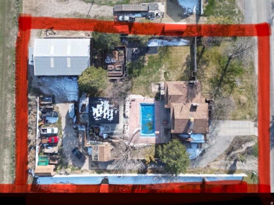 Now Priced at $985,000. Detached studio home (896 sq ft) with immediate income of approximately $1,800/month, ideal for offsetting the mortgage, multigenerational living, or guests, sets this property apart. The detached studio also features a ductless mini-split system for efficient, individual climate control. Situated on a private .93-acre lot at the end of a quiet dead-end road, the property includes a heated 3060 shop with office space, offering exceptional flexibility for vehicles, hobbies, or business use, plus ample additional parking.  The main residence offers 3,100 sq ft, 4 bedrooms, and 4 bathrooms in a versatile multi-level layout with new interior paint and new carpet in the basement family room, along with a newly added three-quarter bathroom. The main home is also equipped with a ductless mini-split heating and cooling system, providing individual room climate control.  Outdoors, enjoy a resort-style backyard with pool, pond, and mature landscaping, creating a private setting ideal for entertaining or relaxing.  A rare opportunity combining income potential, acreage, functional space, and lifestyle - a truly unique offering.