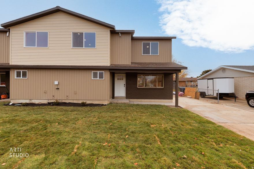 Priced as a townhome but offering the feel of a single-family home, with no HOA, this beautifully rebuilt property is truly unique! While the 1975 brick exterior wall remains, everything else is brand new. What was once a single-story rambler is now a completely reimagined two-story home featuring 4 bedrooms, two family rooms, and a fully reconfigured main level with an all new second story.  Enjoy a stunning kitchen with an over sized island, a large fenced backyard, and touches of personality throughout. From the second floor, take in an unobstructed view of Mount Timpanogos. Located on a quiet street in central Orem, you'll be close to shopping, schools, parks, UVU, BYU, and Provo Canyon.  Construction will be finished shortly after Thanksgiving, with an open house planned at that time-but you're invited to walk the property now. Call for details and a tour. Both sides of the townhome are available: the east side (241 West) will be completed approximately seven days after the west side (243 West).