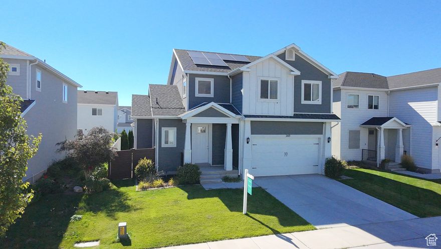 Located in the heart of Vineyard, this beautifully designed two-story home combines modern comfort with inviting spaces, perfect for both everyday living and entertaining. The main level is filled with natural light and features an open-concept layout with a spacious living area, a stylish kitchen with granite countertops and stainless steel appliances, and a dining space that flows seamlessly. Upstairs, the master suite offers a peaceful retreat with a walk-in closet and private ensuite bathroom, while two additional bedrooms, with mountain views, provide flexibility for family, guests, or a home office. The fully finished basement includes a second kitchen, ideal for a mother-in-law unit or extended hosting needs. A generous fenced backyard offers a fire pit and plenty of space for outdoor gatherings, and solar panels help keep utility costs low. The development includes 2 private clubhouses with pools, multiple parks, a splash pad, a zip line, pickleball and b-ball courts. Conveniently located near, top-rated schools, and shopping, this home offers the perfect blend of charm, functionality, and location. Sq Ft per County records, buyer to verify