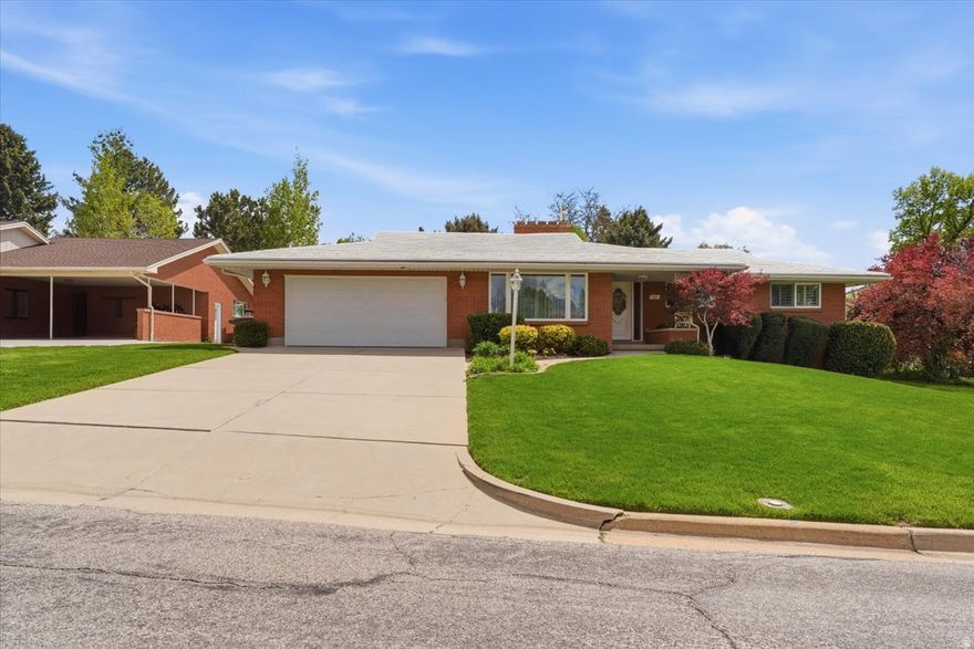ONE OWNER METICULOUSLY CARED FOR HOME! This is a true 10. Rarely has a home been kept this clean or this well maintained. Located on the desirable east bench of Ogden, near trails, schools, and central to commerce as well as walking distance from WSU. This home features beautiful mountain views. This all-brick rambler built in 1963 offers large bedrooms, including a primary suite, two fireplaces, and tons of open living space that feels both comfortable and functional. Basement walks out to back yard from spacious family room. The full two-car garage includes new epoxy flooring and a workbench. The yard is fully fenced and meticulously landscaped, with a covered patio for easy outdoor living. Major updates include a new water softener and water heater, along with the convenience of main floor laundry and a durable metal shingle roof. If you're looking for a home that has been truly cared for, this one stands out immediately. Owner has kept all the records from home maintenance for entire life of home. These can be shared at request.
