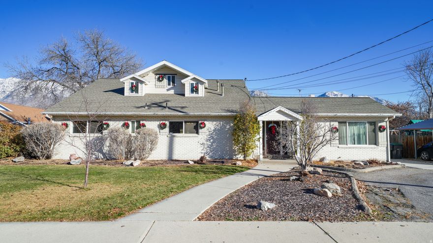 Amazing opportunity in the highly sought-after Grandview Hill neighborhood of Provo! Situated on a rare and expansive .35-acre lot, this property offers an exceptional combination of space, charm, and versatility-inside and out. This spacious home features 6 bedrooms (with the downstairs bedroom easily doubling as a bonus room or additional family room) and 4 full bathrooms, providing plenty of room for comfortable living, guests, or multi-generational needs. The main living area is highlighted by a bright craft room/sunroom, flooding the space with natural light and offering a perfect setting for creative projects, reading, or year-round relaxation. Upstairs, you'll find two bedrooms with vaulted ceilings, each with its own attached bathroom-including the primary suite. The primary suite also includes a bonus flex room, ideal for a private office, den, nursery, or sunny retreat. The yard is truly remarkable-a large, beautifully landscaped outdoor space that's hard to come by in this area and perfect for entertaining, gardening, or simply enjoying peaceful moments at home. Located in one of Provo's premier neighborhoods and close to some of the city's top-rated schools, this home offers both a prime location and a one-of-a-kind living experience. Buyer to verify all listing information.