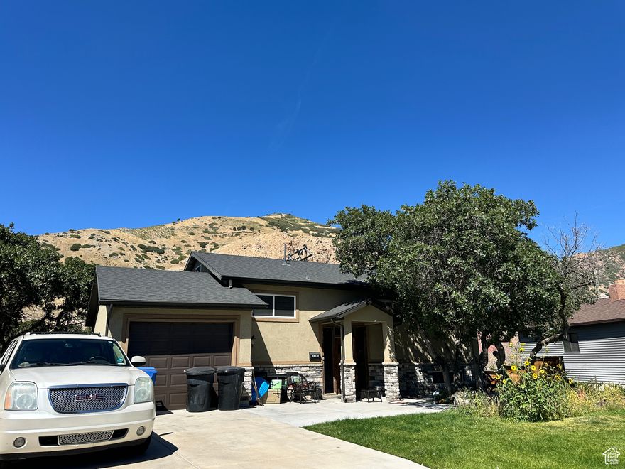 Nestled in Millcreek's prestigious Canyon Rim neighborhood, this charming 4-bedroom, 2-bath home offers serene mountain views and modern updates in a peaceful, half-circle cul de sac setting. From the street, the freshly renovated exterior hints at the care poured into this residence. Inside, soaring picture windows - over 7 feet wide and 6 feet high - frame panoramic views of the Wasatch Range, filling the living spaces with natural light and a sense of tranquility. The thoughtful remodels of 2007 include a new roof, upgraded garage, exterior stucco, and a fully refreshed kitchen. Plumbing for laundry is conveniently installed both upstairs and downstairs, ideal for multi-level living and flexibility. Set on a generous 0.23 acre lot, the property blends outdoor space and accessibility with ease. The quiet half circle street fosters privacy and community, while being just minutes from freeway access and all the amenities that make this area so sought-after. Location highlights:  Quick drive to Park City and multiple world class ski resorts  Nearby mountain biking trails, parks, and recreational access  Excellent schools like Morningside School, Wasatch Jr. High, and Skyline High School,   As is condition:  1957 original structure with 2007 exterior, kitchen, roof, and garage renovation  Spacious updated kitchen  Laundry plumbing upstairs & downstairs  Generous lot in a tranquil cul de sac  Most of the systems and finishes over 16 years old - sold in their present condition Why you'll love it:  Breathtaking mountain views through large picture windows  Easy access to freeway, outdoor adventures, dining, and cultural hubs  Welcoming, quiet neighborhood with pull up parking & attached garage  A smart blend of traditional charm and modern refresh This is more than just a house - it's a slice of Utah mountain living within Salt Lake's friendly, well located Millcreek community. Don't miss the opportunity to call it home.