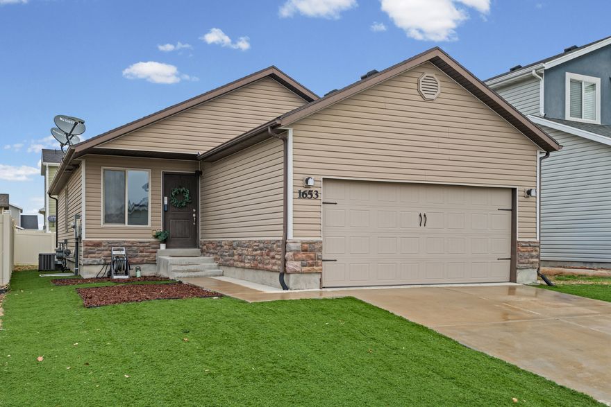 Bringing you a BETTER THAN NEW single-family home that is sparkly clean and move-in-ready! This adorable rambler is in a peaceful neighborhood and recently updated with all new carpet and fresh paint throughout, giving every room a bright, refreshed feel. With six bedrooms and three bathrooms, the fully finished layout offers flexible space for family living, guests, or a home office.  The yard is designed for easy living with low-maintenance artificial turf, offering year-round greenery with minimal upkeep. Inside and out, the home has been well cared for and is truly turnkey.  Updated, affordable, and competitively priced, this is a fantastic opportunity for anyone seeking comfort, simplicity, and value in a quiet community.