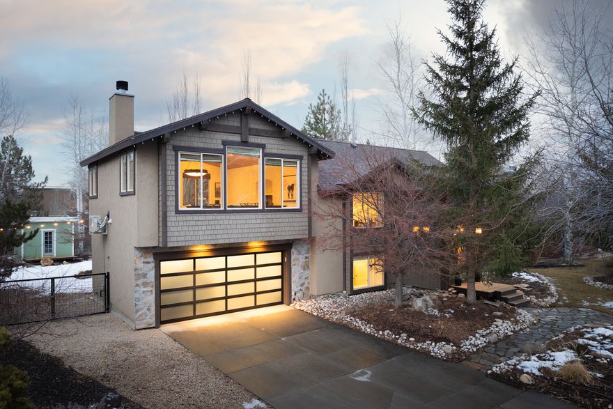 Welcome to 858 Red Maple Ct, a beautifully remodeled home tucked away on a quiet cul de sac in the highly desirable Park Meadows neighborhood of Park City. Offering 4 bedrooms, 4 bathrooms, and 2,583 square feet across two levels, this home stands out for its thoughtful custom remodel and the rare, sweeping mountain views that are hard to find in Lower Park Meadows. The great room is the true centerpiece, featuring expansive wrap around windows that capture breathtaking views of the surrounding mountains and Park City Mountain Resort. Natural light pours into the home, creating an inviting and modern atmosphere throughout the open concept layout. The kitchen flows seamlessly into the main living space and out to the brand new back deck, overlooking a mature, private yard that feels like a true retreat. This location delivers the best of Park City living with quick access to hiking and biking trails, nearby open space, and local favorites like the Park Meadows trail system and bike park. You are also just minutes from Park City Mountain Resort, grocery stores, dining, and everyday conveniences, making it an ideal primary residence or second home. The property also includes custom plans for future expansion, offering an excellent opportunity to grow into the home over time while preserving the value of this exceptional lot. With its rare view corridor, peaceful setting, and unbeatable central location, 858 Red Maple Ct is a standout opportunity in one of Park City's most sought after neighborhoods.