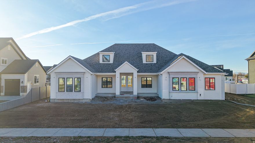 Crafted by a distinguished luxury builder and three-time consecutive  Parade of Homes winner, this fully custom 5-bedroom, 3.5-bathroom masterpiece rests on a private half-acre lot in the heart of Mapleton, Utah. Spanning 5,081 square feet, the home showcases High ceilings, expansive windows that have beautiful mountain views, and an abundance of natural light that highlights exquisite high-end finishes throughout. The chef's kitchen is a standout, appointed with white oak cabinetry, premium appliances, stunning quartz and quartzite countertops, and designer lighting. Perfect for entertaining. The lower level boasts a spacious theater room and full bar. Seamlessly blending sophisticated elegance with Luxury living, this extraordinary residence offers an unparalleled living experience.  **Estimated completion date is January 30th 2026**