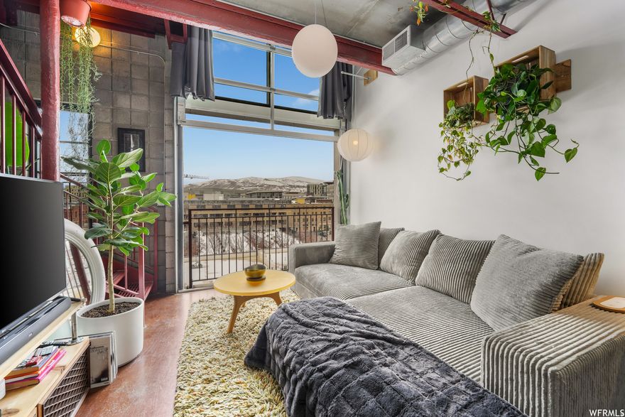 Amazing downtown SLC industrial loft condo with private roof! Minutes walk to anything downtown. This unique condo has so much character from the exposed pipes, concrete walls, and the garage style door in your living room. This condo is a true downtown living experience. Don't miss the 3rd level where you'll walk out to your own private rooftop deck.