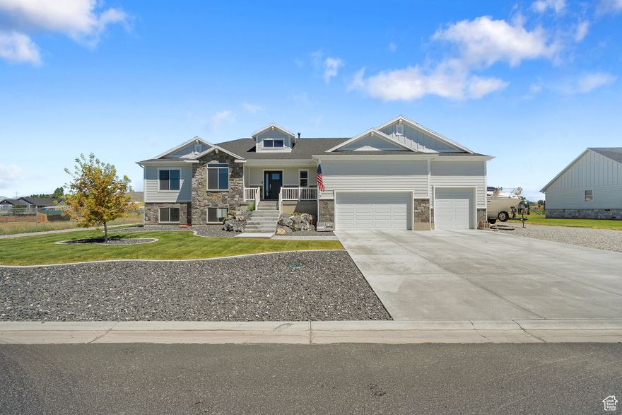 Escape the hustle of city life and embrace wide-open skies in this stunning home set on over one acreof land. With unobstructed mountain views, a valuable water share, and plenty of space to grow, this is the perfect blend of modern luxury and rural serenity. Step inside to find a thoughtfully designed 3-bedroom, 2-bath layout including a spacious primary bedroom with a walk-in closet and private ensuite. The kitchen is complete with double ovens, stainless steel appliances, and upgraded finishes throughout. The open-concept living area offers natural light and mountain views from every angle. Outside enjoy a professionally landscaped yard and various options for parking and storage with an RV pad and a 4-car garage.